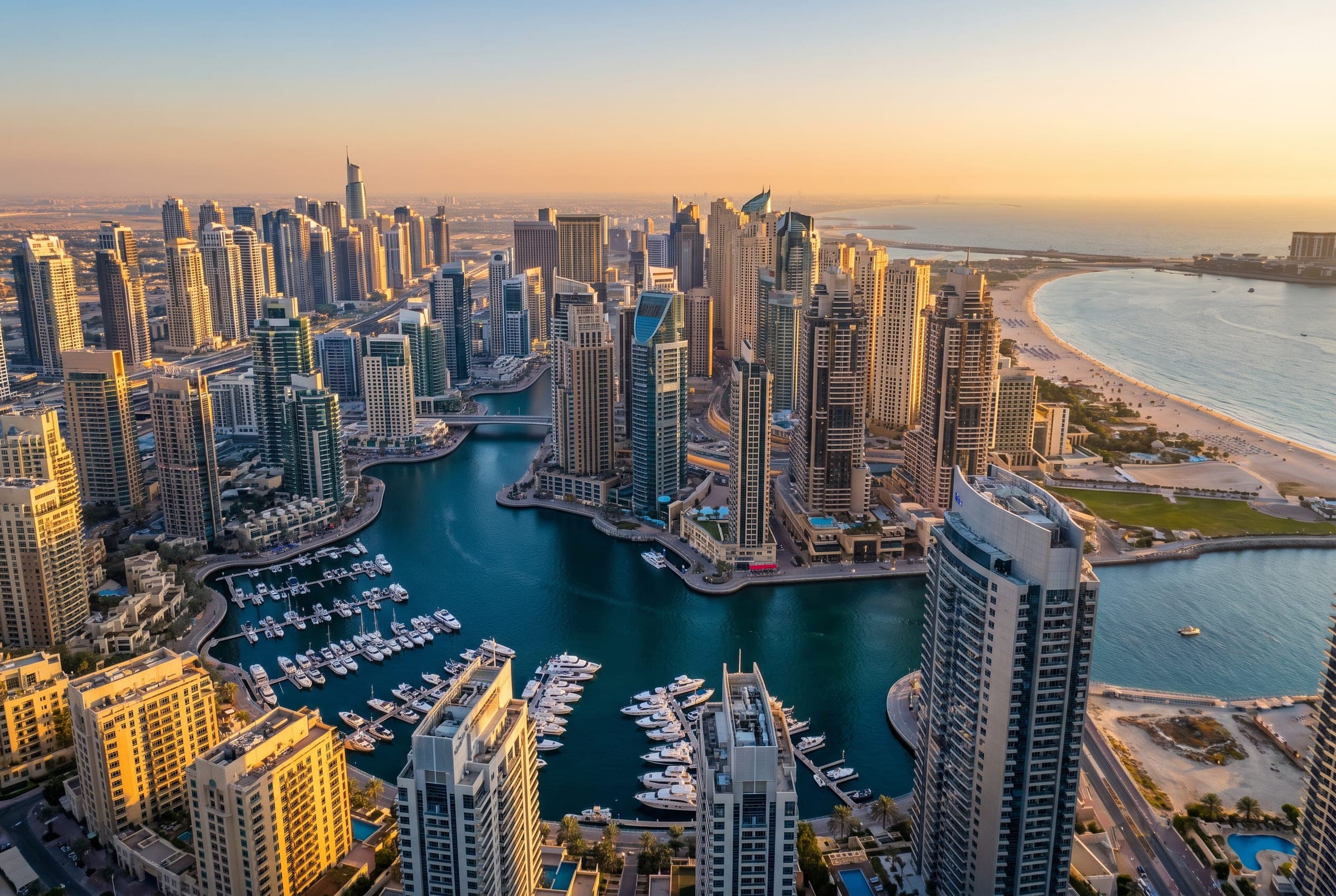 Dubai Marina and the coastline from above at sunset